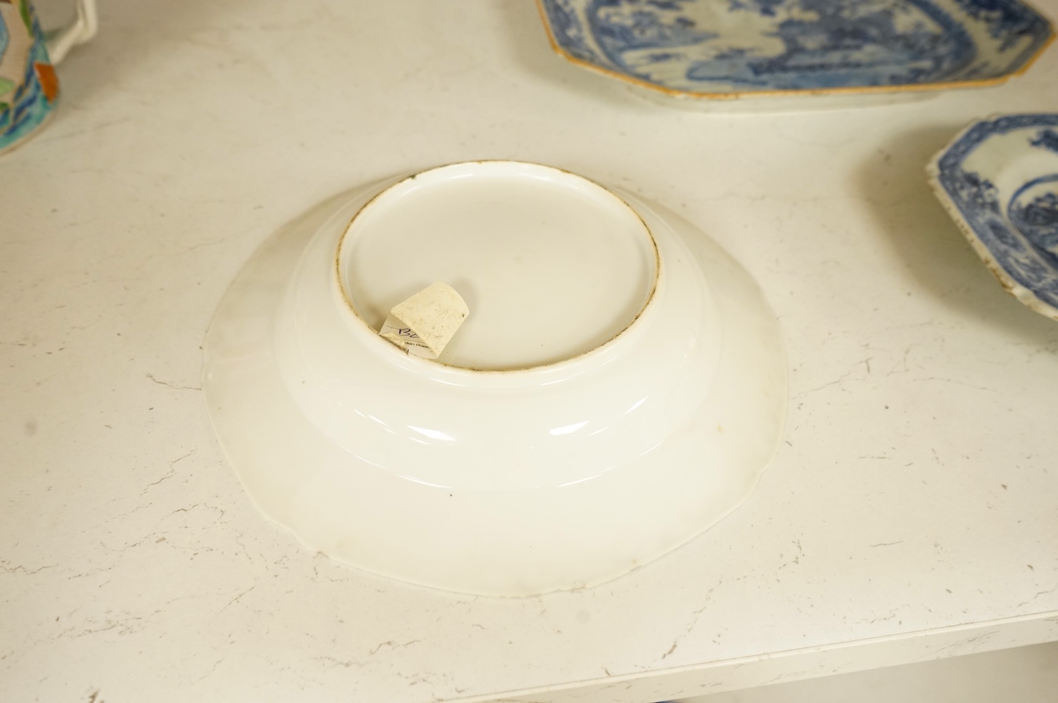 Two 18th century Chinese blue and white dishes and a similar plate, largest 29cm